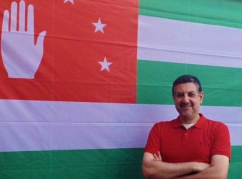 Mohammed Abaza with the Abkhaz flag