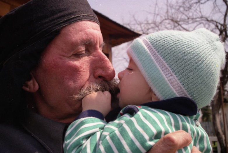 Father of Ruslan Khashig Mkan with grandson Ainar, Huap, 1998